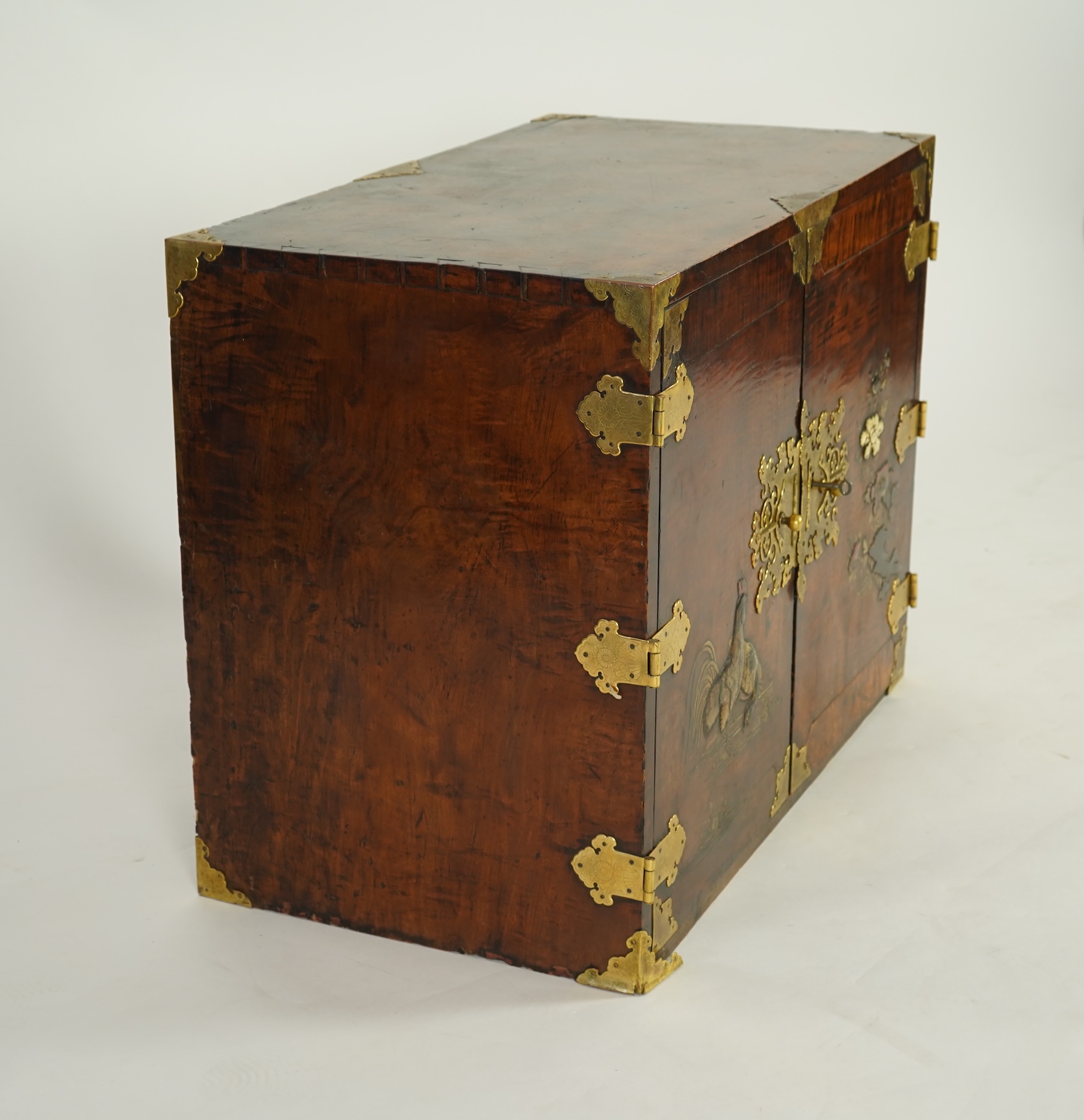 A Japanese mulberry wood, hiromaki-e lacquer and gilt copper mounted cabinet, c.1680-1700